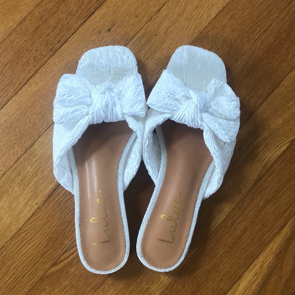 Lulu’s Lortho white satin pleated bow slide sandals